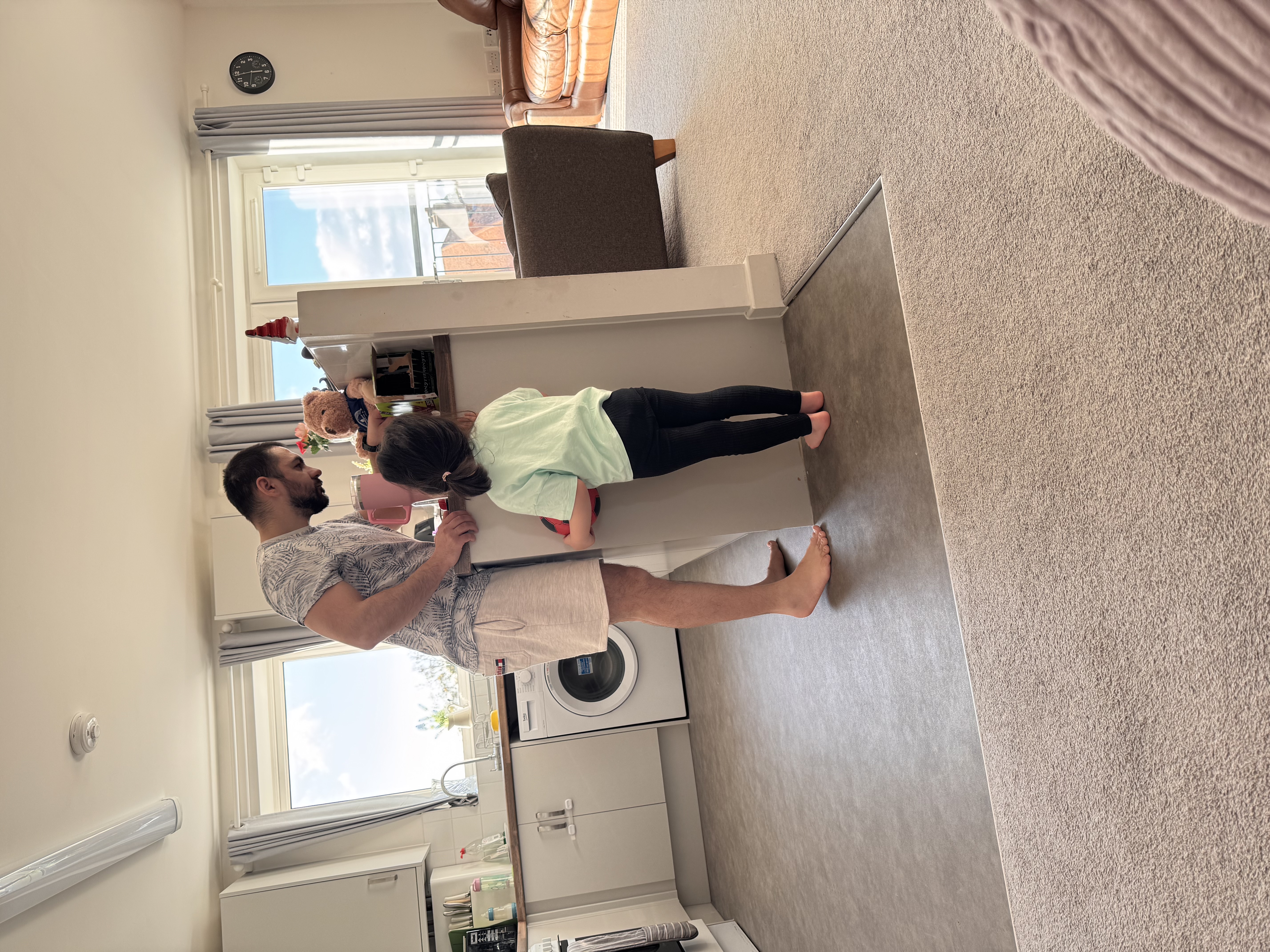 Dad and daughter at the kitchen counter